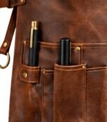 Brown leather apron with two pens in pockets