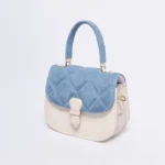 Quilted blue and cream leather handbag with a top handle and buckle closure