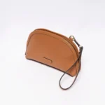 Brown leather wristlet bag with zip closure and wrist strap