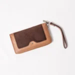 Brown leather and suede clutch wallet with wrist strap