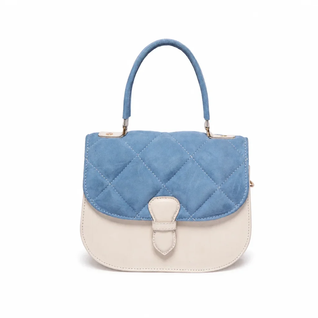 Quilted blue suede and ivory leather handbag with top handle and buckle closure