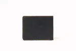 Black leather bi-fold wallet with contrast stitching on a white background