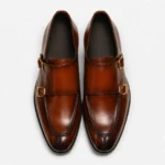 Brown leather double monk strap dress shoes with gold buckles