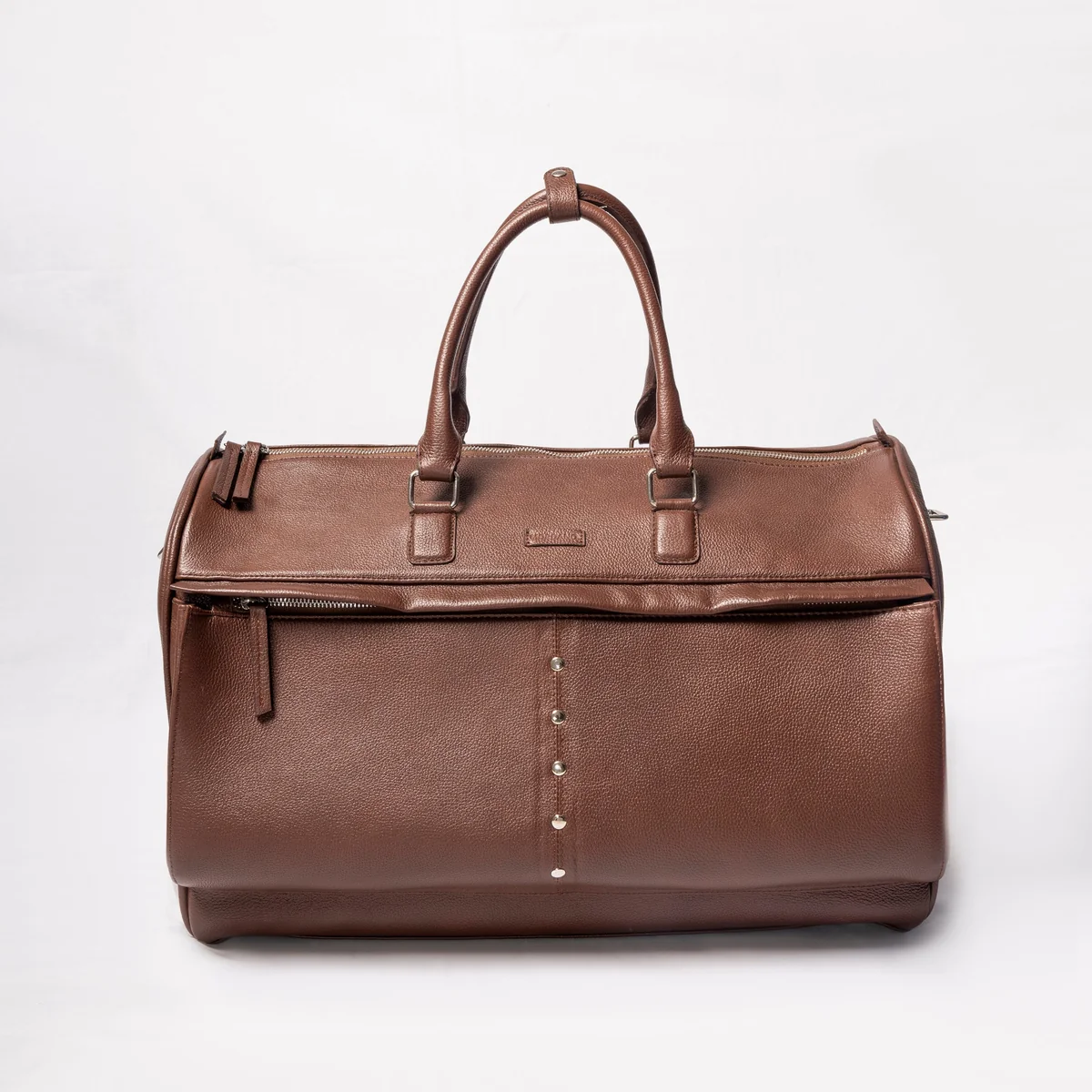 34 (1) Brown leather duffel bag with silver stud detail and zippered compartments
