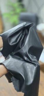 Black leather draped and folded