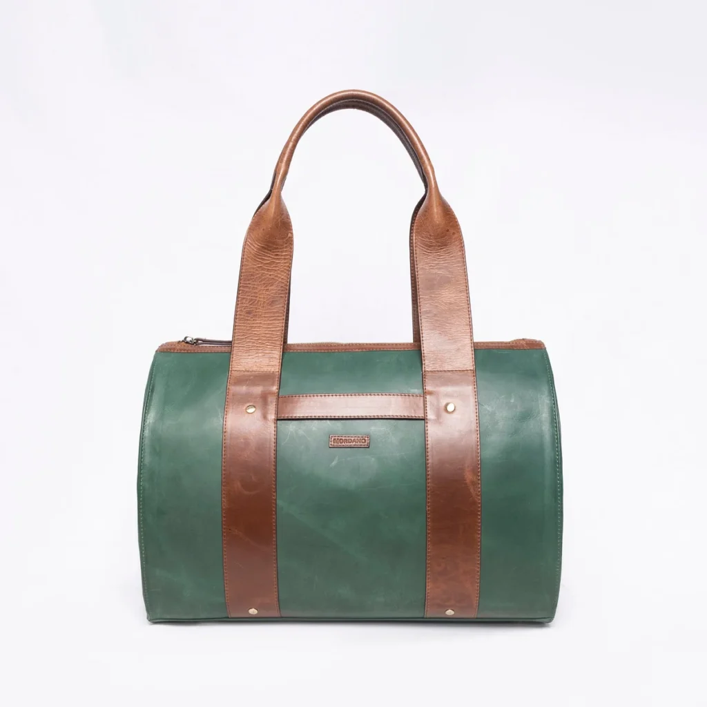 Green and brown leather duffel bag with handles