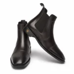 Dark brown leather Chelsea boots with elastic side panels and a gold emblem on the heel