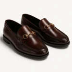 Brown leather loafers with gold horsebit detail