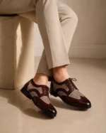 Brown leather wingtip shoes with houndstooth fabric panels