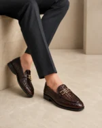 Brown woven leather loafers with gold buckle detail