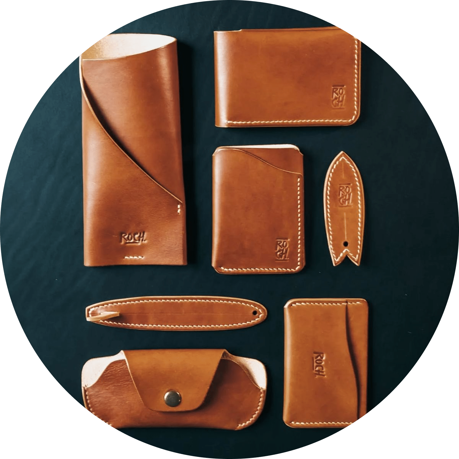 Brown leather cardholders, cases, and surfboard-shaped keychain