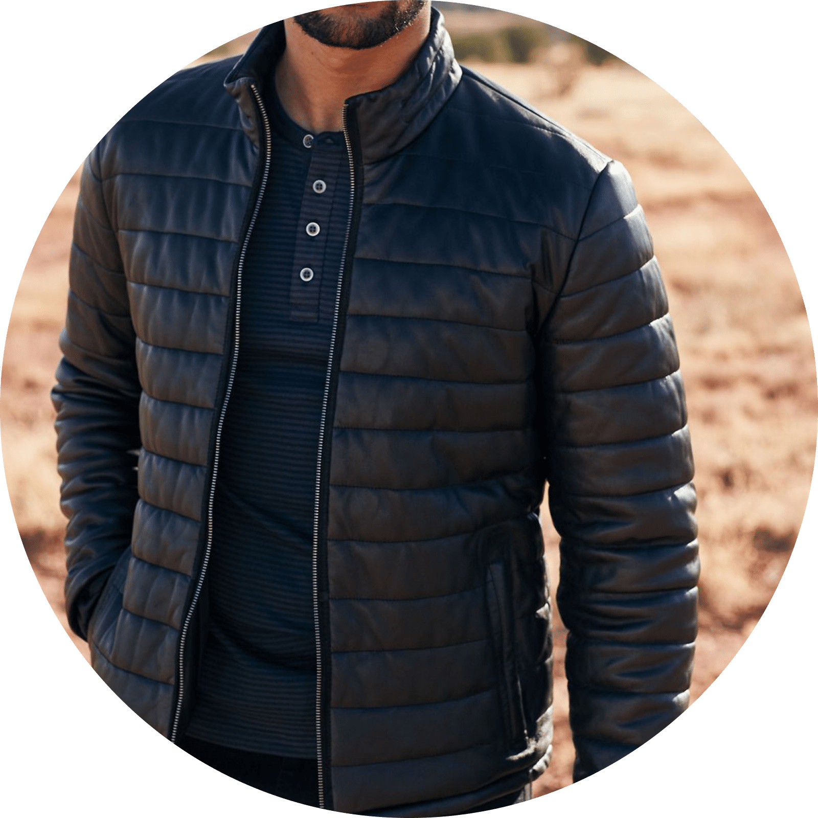 Man wearing a black quilted leather jacket over a striped Henley shirt