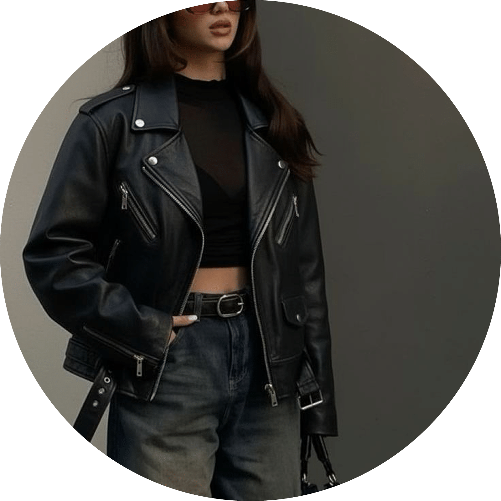 Black leather moto jacket with silver zippers and buckles worn with denim jeans