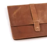 Brown leather portfolio with strap closure