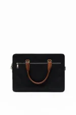 Black laptop bag with brown leather handle and silver hardware