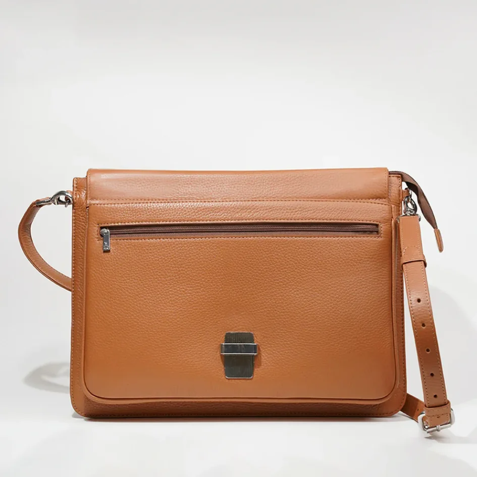 img_68b6c1efe45b85.87828176 Brown leather satchel with a zippered pocket and a clasp closure