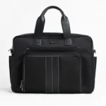 Black leather briefcase with multiple zip compartments and stitched detailing