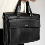 Black leather briefcase with zippered top and front pocket