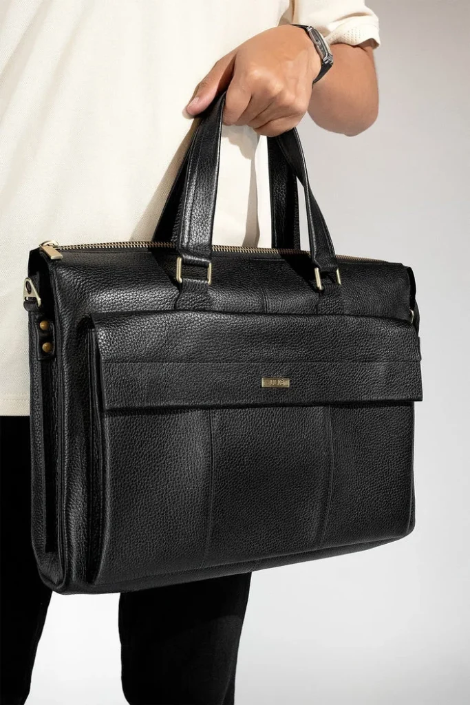 Black leather briefcase with zippered top and front pocket