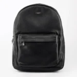 Black textured leather backpack with front pocket and metal logo