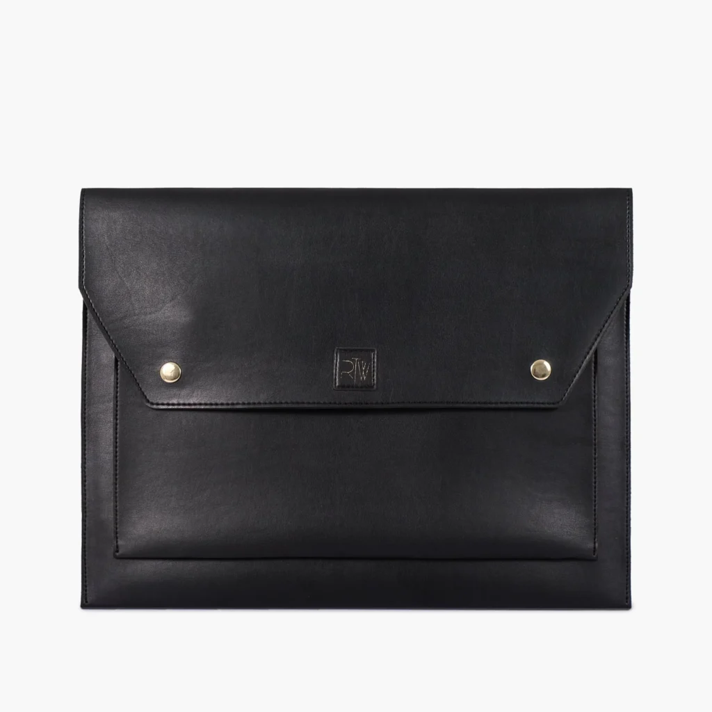 Black leather envelope clutch with gold snaps and embossed logo